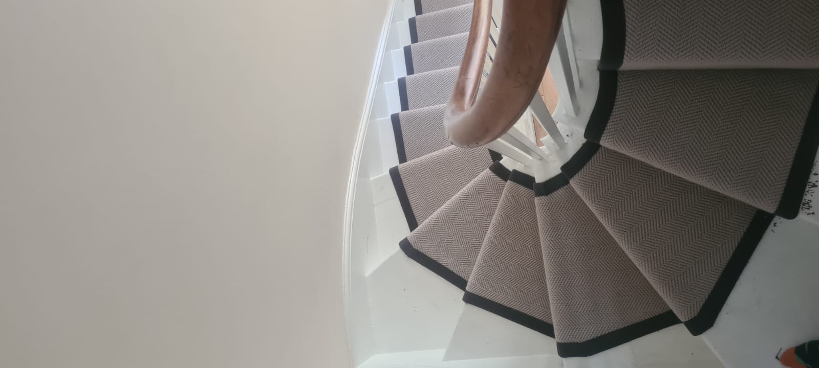 Black taped flatweave stair runner on staircase