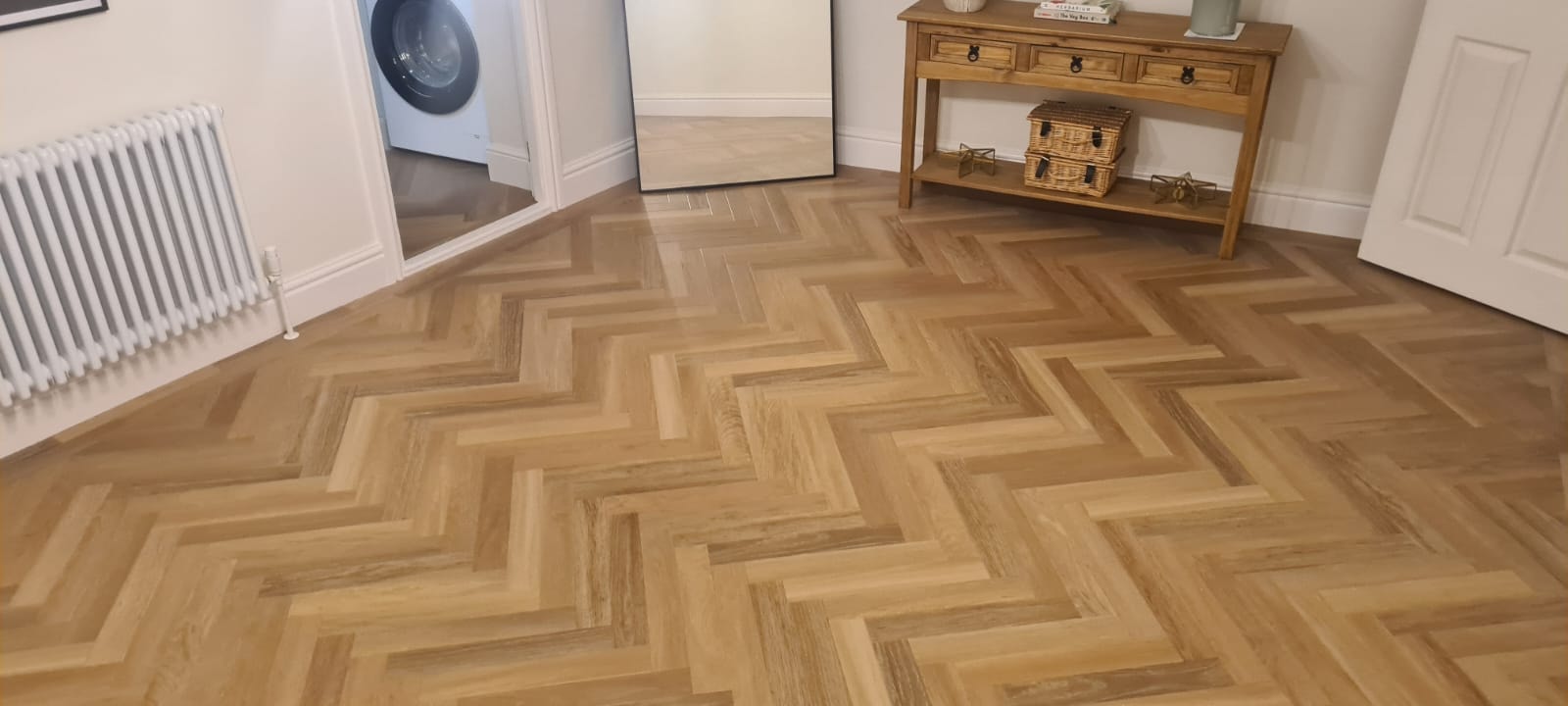 Herringbone wood floor in a modern living room